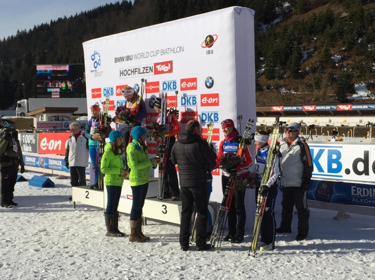 Canada's Rosanna Crawford (at right) receiving her fifth-place award after achieving a career best in the IBU World Cup 10 k pursuit in Hochfilzen, Austria. (Photo: Chris Lindsay)