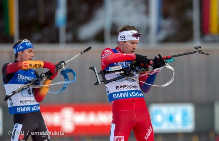 Germany's Simon Schempp (l) and Norway's Emil Hegle Svendsen go head to head in the final shooting stage of the men's 4 x 7.5 k relay in Ruhpolding, Germany. (Photo: IBU/Ernst Wukits)