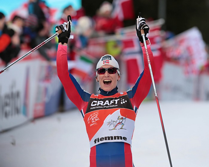 Marit Bjørgen of Norway celebrates her 2015 Tour de Ski victory at the finish line of the final stage in Val di Fiemme, Italy (Photo: Val di Fiemme/www.fiemmeworldcup.com) 