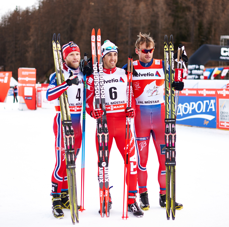 Martin Johnsrud Sundby (NOR), Federico Pellegrino (ITA) and Petter Northug (NOR), (l-r) take the men's podium in Val Mustair (SUI). (photo: Fischer/Nordic Focus)