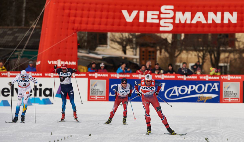 Calle Halfvarsson (SWE), Evgeniy Belov (RUS), Martin Johnsrud Sundby (NOR and Petter Northug (NOR), (l-r) come to the line at the end of the Tour de Ski pursuit in Cortina-Toblach (ITA).  (photo: Fischer / Nordic Focus)