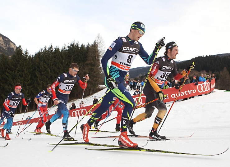 Kazakhstan's Alexey Poltoranin (bib 8) races alongside Germany's Thomas Bing (bib 36) in the Tour de Ski 15 k classic mass start in Val di Fiemme, Italy (Photo: al di Fiemme/www.fiemmeworldcup.com) 
