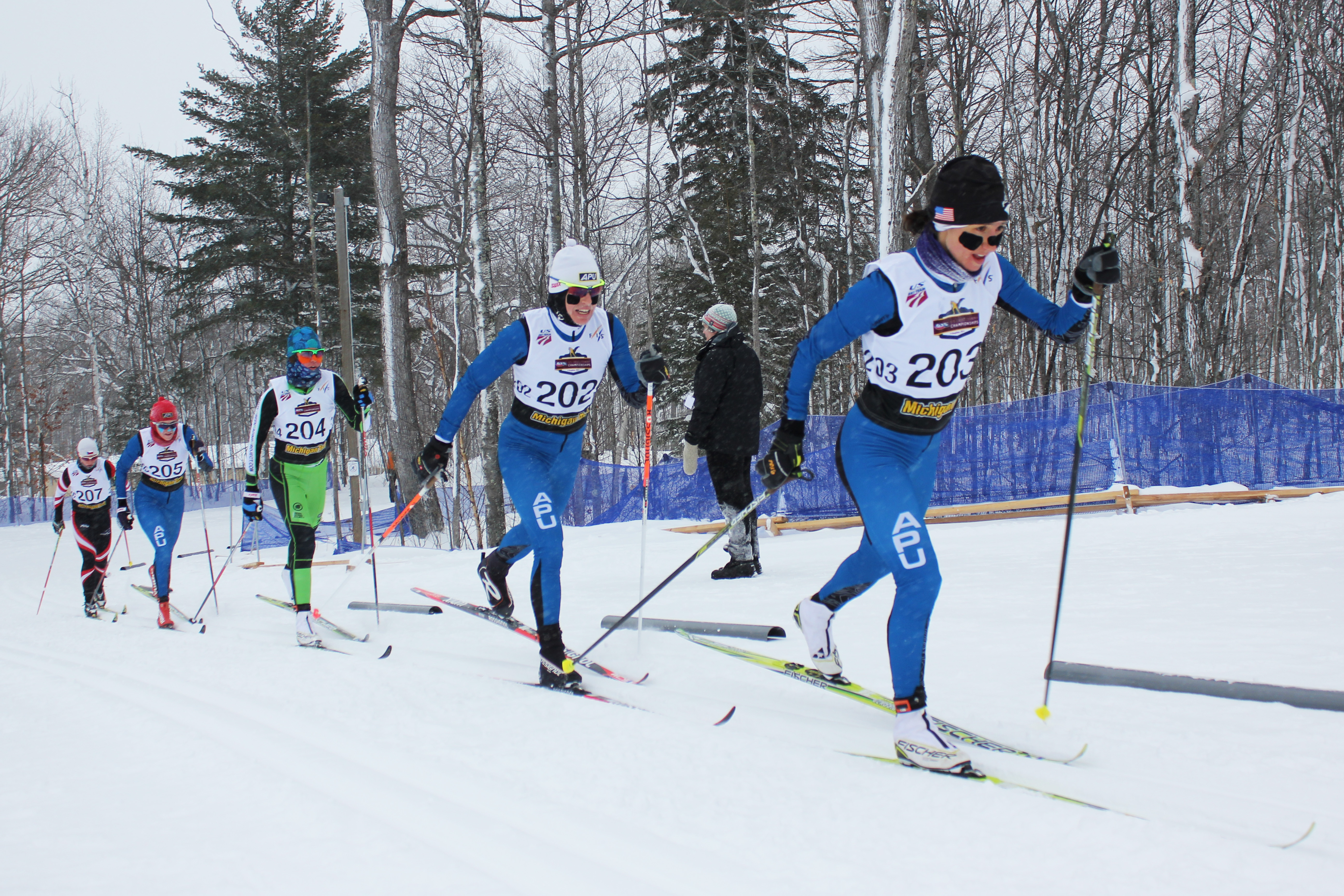 Chelsea Holmes (APU) leads Rosie Brennan (APU), Caitlin Patterson (CGRP), Becca Rorabaugh (APU), and Eliska Hajkova (BJRNT) in the women's 20 k mass start at the 2015 U.S. Cross Country Championships in Houghton, Mich.