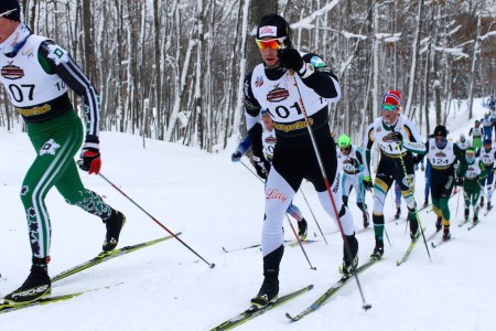 Kris Freeman (near) and Dartmouth's Paddy Caldwell (l) skiing near the front of the pack around 2 k into the men's 30 k classic mass start on Thursday at U.S. nationals in Houghton, Mich.