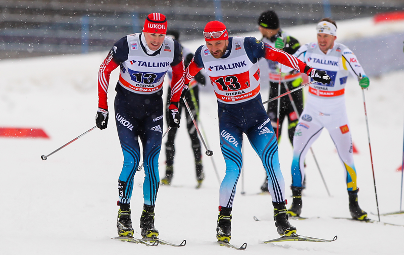 Alexey Petukhov (r) tags Sergey Ustiugov during  the men's 6 x 1.5 k freestyle team sprint final on Sunday in Otepää, Estonia. The two went on to win by 0.4 seconds over Norway. (Photo: Fischer/NordicFocus) 