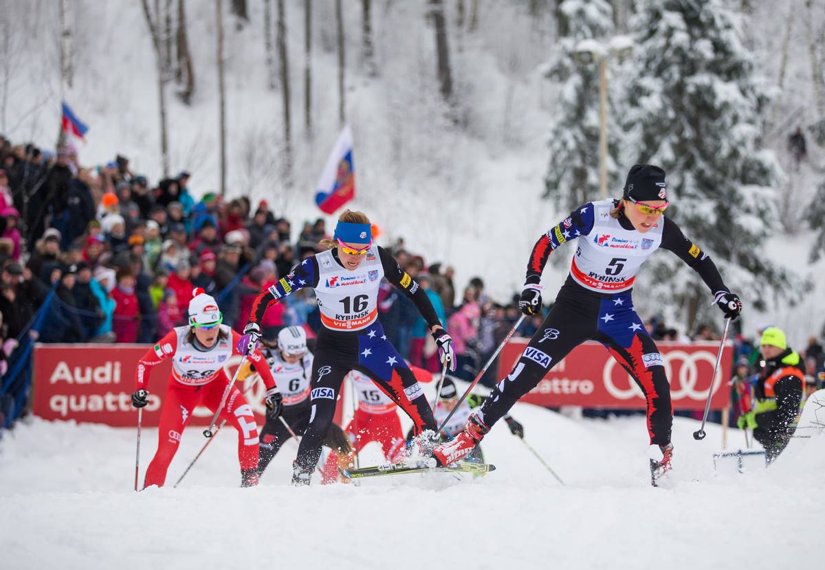 Ida Sargent (5) leads Sophie Caldwell (16) up the final hill of the 1.3 k freestyle sprint quarterfinal in Rybinsk, Russia. Sargent finished third in the heat while Caldwell placed second. Caldwell and Sargent finished seventh and 13th overall. (Photo: Fischer/Nordic Focus)