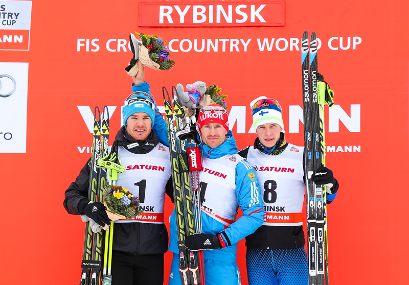 The men's 30 k skiathlon podium (from l-r):Dario Cologna (SUI) in second, Maxim Vylegzhanin (RUS) in first, and Matti Heikkinen (FIN) in third. (Photo: Fischer/Nordic Focus) 