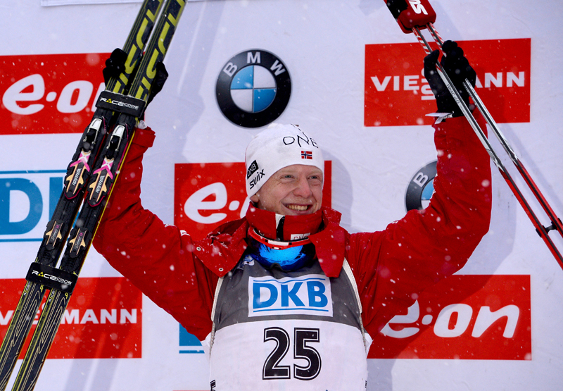 Johannes Thingnes Bø of Norway celebrates his IBU World Cup sprint victory on Saturday in Ruhpolding, Germany. He cleaned both stages and posted the fastest-overall course time to win by nearly 25 seconds. (Photo: Fischer/NordicFocus)