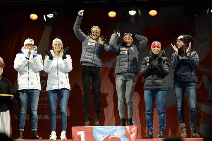 The women's freestyle team sprint podium at the medals ceremony on Sunday night at 2015 World Championships in Falun, Sweden. Norway's Ingvild Flugstad Østberg (third from l) and Maiken Caspersen Falla (third from r) teamed up for gold, Sweden's Ida Ingemarsdotter (l) and Stina Nilsson (second from l) took silver, and Poland's Sylwia Jaskowiec (second from r) and Justyna Kowalczyk (r) tallied bronze. (Photo: Falun2015/Twitter)