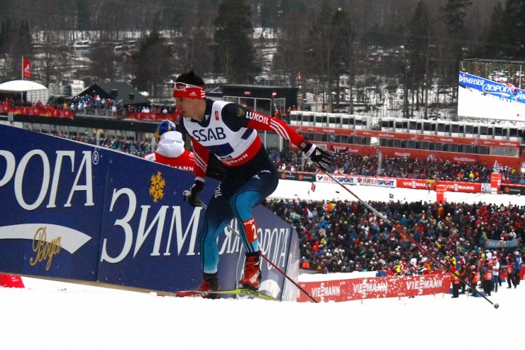 Russia's Evgeniy Belov in fourth tries to close the gap to the top three, on his first of four laps in the men's 4 x 10 k relay at 2015 World Championships in Falun, Sweden.