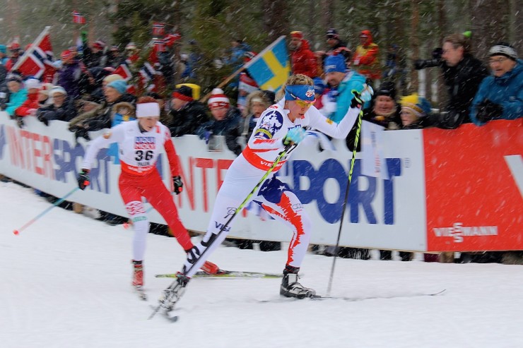 Jessie Diggins (U.S. Ski team) leads Ekaterina Rudakova of Belarus, whom Diggins passed, up "little" Mördarbacken early in the women's 10 k freestyle individual start at 2015 World Championships in Falun, Sweden. Diggins went on to take silver for the best-ever U.S. women's distance result at an international championships; Rudakova placed 39th.