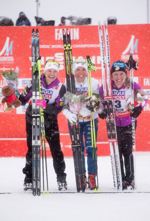 Americans Jessie Diggins (l) and Caitlin Gregg (r) share the women's World Championships 10 k freestyle podium with Sweden's Charlotte Kalla (c), who won the race by 41 seconds for her first individual gold on Tuesday in Falun, Sweden. Diggins took second while Gregg took third, 46.9 seconds back. Both finishes were the best distance result in history for a U.S. woman at a World Championships. (Photo: Fischer/NordicFocus)