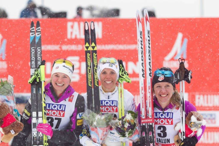 Americans Jessie Diggins (l) and Caitlin Gregg (r) share the women's World Championships 10 k freestyle podium with Sweden's Charlotte Kalla (c), who won the race by 41 seconds for her first individual gold on Tuesday in Falun, Sweden. Diggins took second while Gregg took third, 46.9 seconds back. Both finishes were the best distance result in history for a U.S. woman at a World Championships. (Photo: Fischer/NordicFocus)