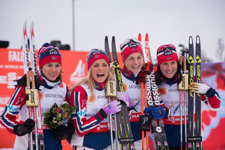 The Norwegian relay team of Heidi Weng, Therese Johaug, Astrid Jacobsen, and Marit Bjørgen pose after winning the 4 x 5 k relay at the 2015 FIS Nordic World Ski Championships in Falun, Sweden. (Photo: Fischer/NordicFocus) 