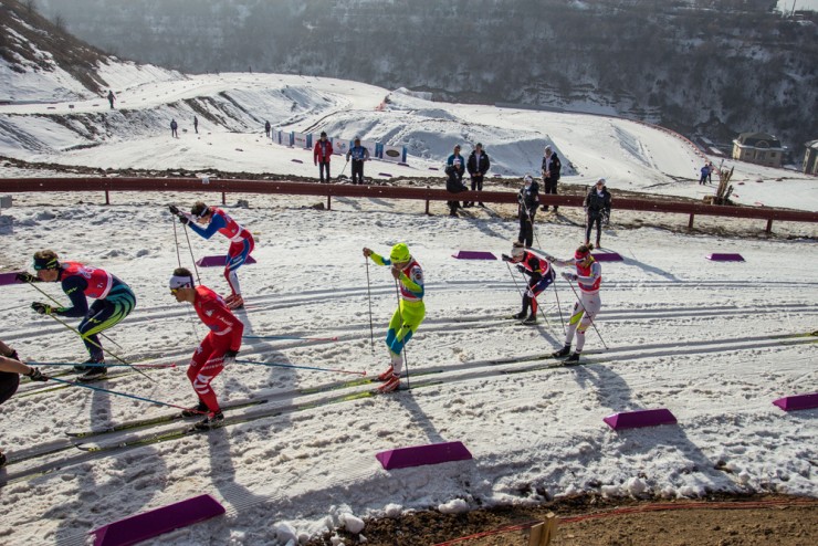 The venue in Almaty, Kazakhstan, was faced with problems of snow shortages during Junior and U23 World Championships in early February. Here, American Thomas O'Harra (back left) staying with the leaders during the first leg of the junior men's relay; his team would go on to finish 11th. (Photo: Logan Heinemann) 