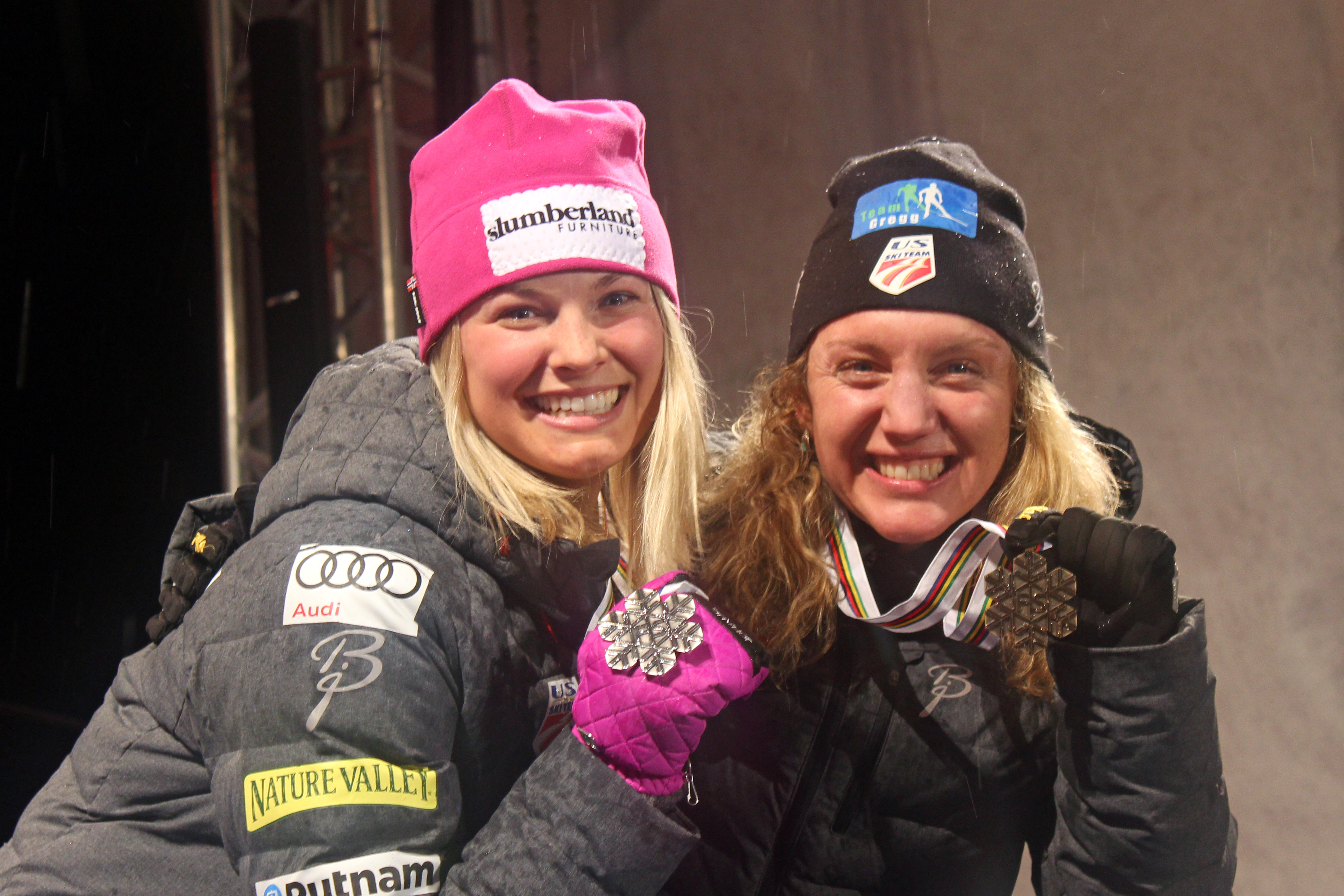 Americans Jessie Diggins (l) and Caitlin Gregg (r) hold up their silver and bronze medals from the 10 k freestyle at the 2015 FIS Nordic World Ski Championships in Falun, Sweden. 