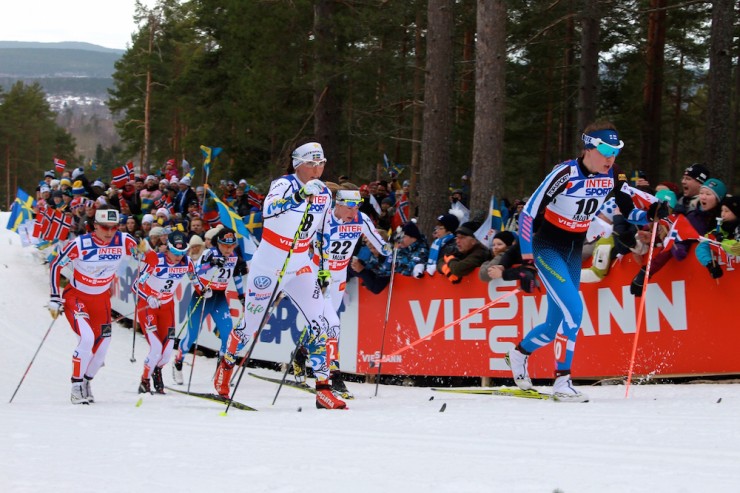 Finland's Kerttu Niskanen and Sweden's Charlotte Kalla skiing together in pursuit of Therese Johaug, a Norwegian who dropped the field to score a big win in the 30 k classic.