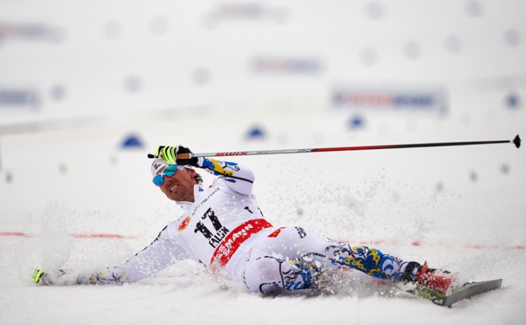 Johan Olsson of Sweden collapses after posting the best time in Tuesday's 15 k freestyle at the 205 FIS Nordic World Ski Championships in Falun, Sweden (Photo: Fischer/Nordic Focus) 