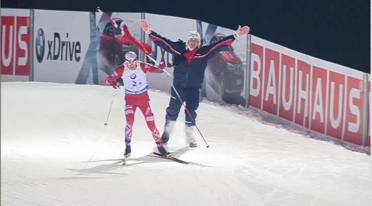 Tarjei Bø receives the Norwegian flag from an excited fan as he cruises down the finishing stretch to celebrate his win for Norway in the 2 x 6 + 2 x 7.5 k mixed relay on Friday at the IBU World Cup in Nove Mesto, Czech Republic.