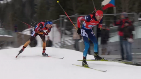 Anton Shipulin of Russia leading Simon Schempp of Germany on the final loop of the relay.