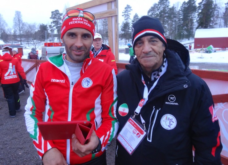 Seyed Sattar Seyd of Iran (l) with his coach after the men's 10 k freestyle individual start qualification race on the first day of 2015 World Championships in Falun, Sweden.  