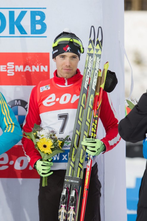 Canada's Nathan Smith at his first-ever awards ceremony after placing a career-best fifth on Sunday in the IBU World Cup 12.5 k pursuit in Nove Mesto, Czech Republic. (Photo: Biathlon Canada/NordicFocus)