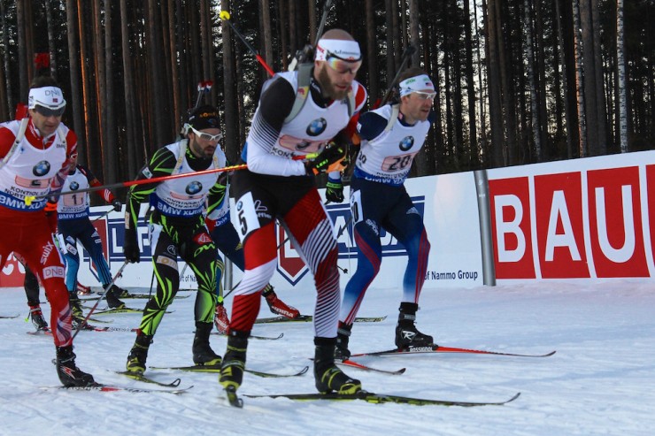 American Lowell Bailey (r) enters the range with race leaders Daniel Mesotitsch of Austria (second from r), France's Simon Fourcade (second from l), and Norway's Ole Einar Bjørndalen (l) for the first time in the men's 4 x 7.5 k relay at 2015 IBU World Championships in Kontiolahti, Finland. 