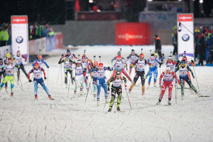 Anais Bescond of France (center, in black) leads the first leg out of the start in Thursday's mixed relay at IBU World Championships in Kontiolahti, Finland. (Photo: Biathlon Canada/NordicFocus)