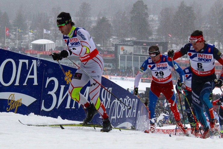 Canada's Alex Harvey leads Russia's Maxim Vylegzhanin (4) and the Czech Republic's Lukas Bauer (29) up a steep hill around 29 k in the men's 50 k classic mass start at 2015 World Championships in Falun, Sweden.