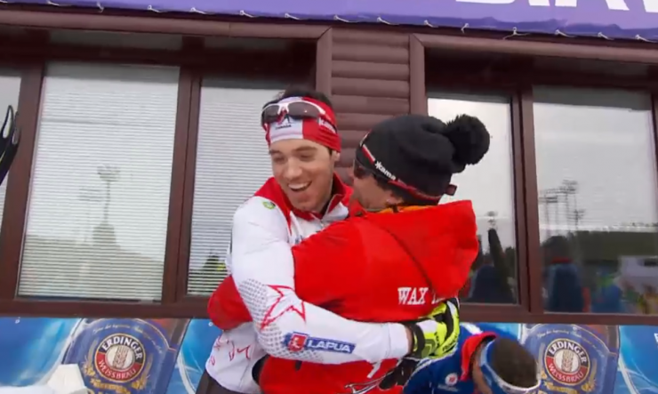 Canadian head wax tech Tom Zidek gives Nathan Smith a hug at the finish line after Smith's first victory.