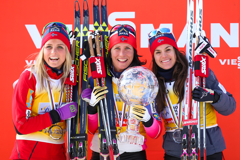 Marit Bjørgen won the overall FIS World Cup title for the fourth time in 2014-2015, also taking home the Sprint Cup and Distance Cup globes. Along with Therese Johaug, who won it in 2015-2016 (left) and Heidi Weng, she trains more than you. (Photo: Fischer/NordicFocus.com)