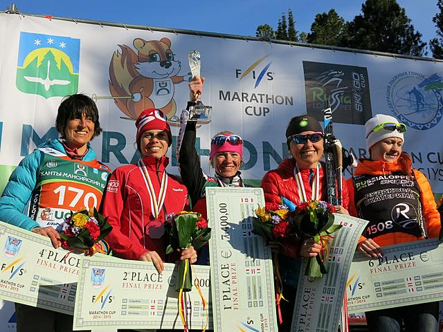 Holly Brooks (2nd from the right) was third in the 2015 FIS Marathon Cup, after finishing 10th in the final event, the 50 k freestyle race Ugra Ski Marathon in Siberia, Russia, on Saturday. Tatjana Mannima of Estonia (center) won the overall Marathon Cup, and Aurelie Dabudyk of France was second (2nd from the left). Photo: FIS/Worldloppet