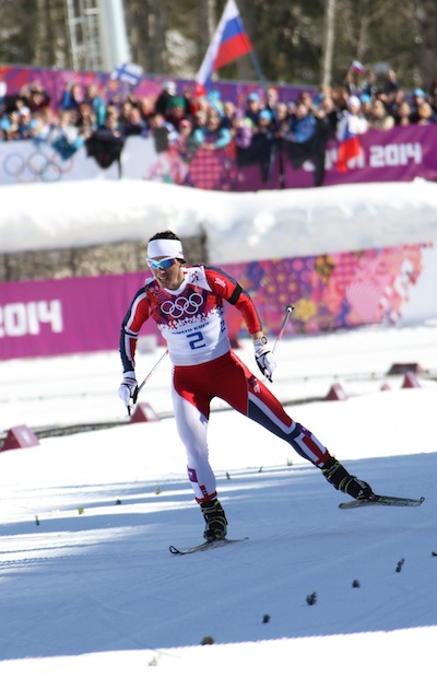 Marit Bjørgen wearing a black armband on her left arm in honor of teammate Astrid Jacobsen’s brother, who died by suicide the day before Bjørgen won the Olympic skiathlon.
