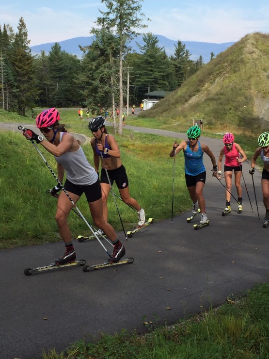 Sun Valley's Mary Rose (l) leads Katherine Ogden (SMST2/USST), Annie Pokorny (SMST2), Erika Flowers (SMST2), and Paige Schember (SVSEF) during a sprint simulation at the Olympic Jumping Complex rollerski trails in Lake Placid, N.Y. (Photo: Colin Rodgers)