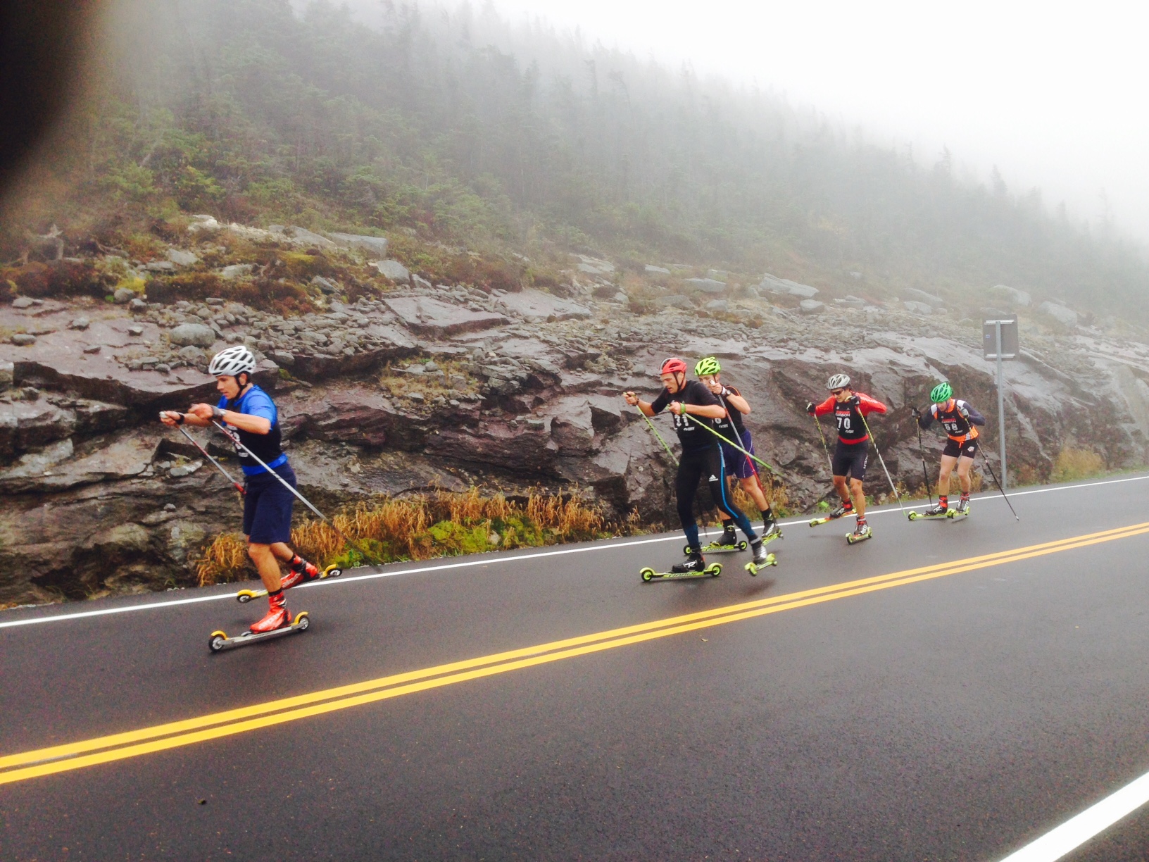 Paddy Caldwell of the U.S. Ski Team D-team won today's Climb to the Castle up Whiteface. Here he's seen around mile 4 leading the pack, which includes veteran biathlete Tim Burke (who placed 3rd). (Photo: Tim Cowan)