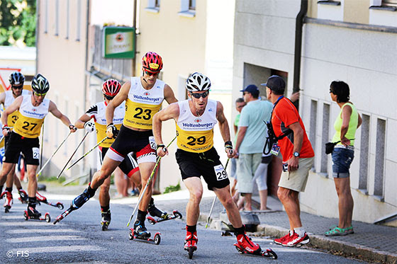 U.S. Nordic Combined skier Taylor Fletcher leads a pack up a city street in Oberwiesenthal, Germany, during the Summer Grand Prix last weekend. (FIS-Sandra Volk)