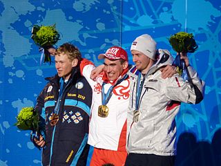 Norway's Nils Erik Ulset (right) with a Russian gold medalist at the 2014 Paralympic Games. (Photo: Matt Boulton / Wikimedia Commons)