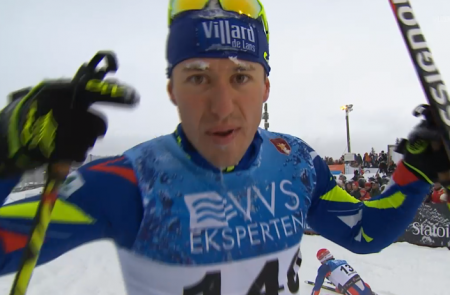 Robin Duvillard of France approaches TV cameras with the message "Pray for Paris" at the finish of Saturday's 15 k skate FIS race in Beitostølen, Norway.