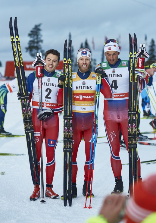The all-Norwegian men's podium after the Ruka Triple 15 k classic pursuit on Sunday at the World Cup in Kuusamo, Finland, with, Martin Johnsrud Sundby (c) in first, Finn Hågen Krogh (l) in second and Petter Northug (r) in third. (Photo: Fischer/NordicFocus)
