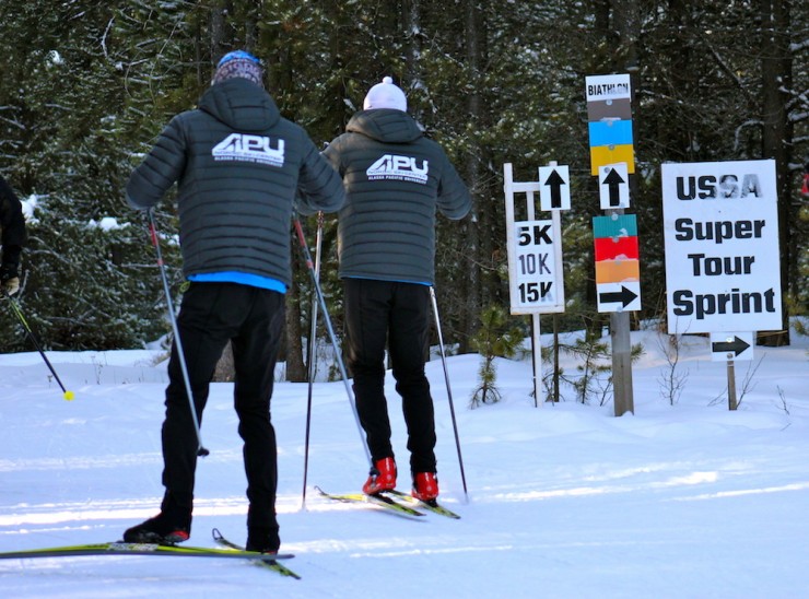 APU wax techs test skis on Thursday at the start of the sprint course at the Rendezvous Ski Trails in West Yellowstone, Mont.