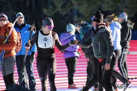 BSF Elite athlete Jennie Bender (l) and head coach Bernie Nelson fist bump before the start of the women's SuperTour sprint A-final on Friday November 27th in West Yellowstone. Bender went on to place first overall.