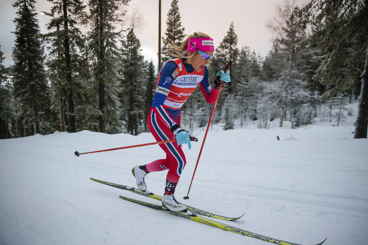 With the Arctic sun low on the horizon, Therese Johaug of Norway outran the entire field. (Photo: Fischer/NordicFocus)