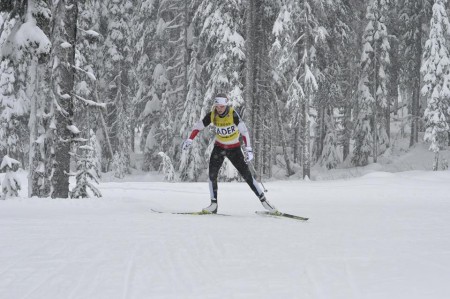 Dahria Beatty (AWCA) in the leader's bib during a snowy women's NorAm 10 k freestyle individual start on Sunday in Vernon, British Columbia. (Photo:  XTS Photography)
