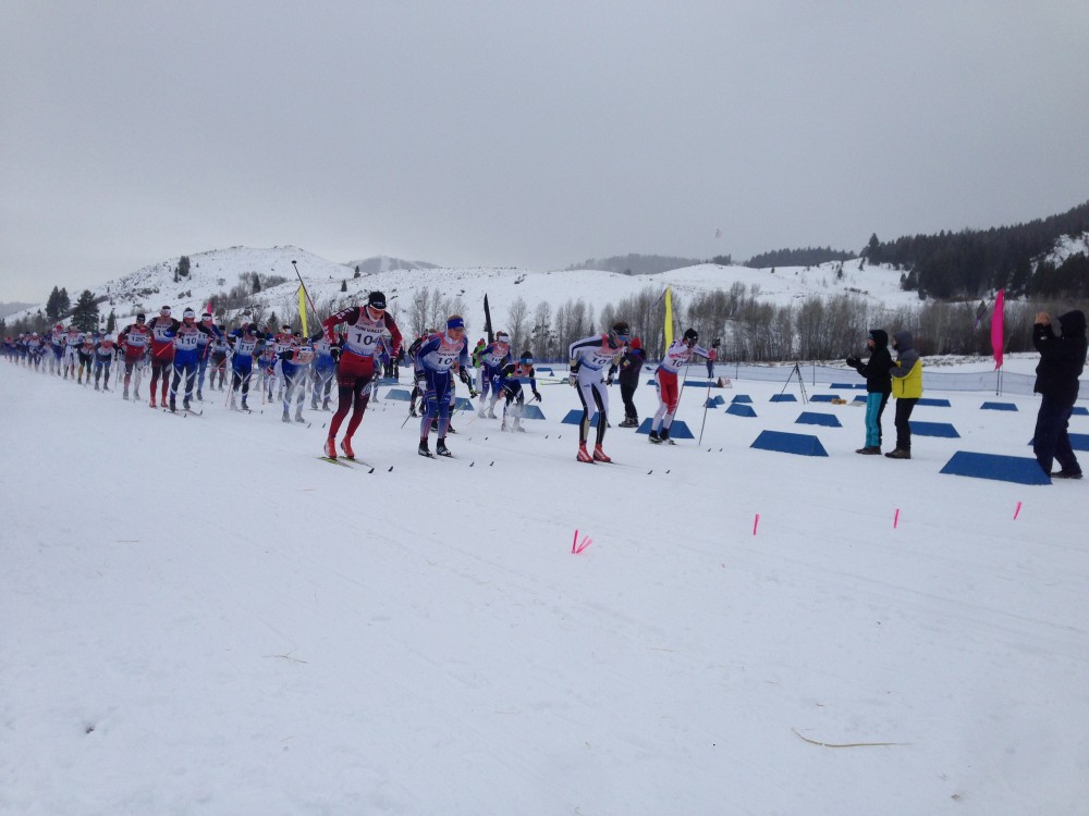 Mads Strøm (center, in white) leads Niklas Persson (left), Matt Gelso (second from left, in blue), Paddy Caldwell (right), and the rest of the mens field out of the start in the 15 k classic at the Sun Valley Super Tour.