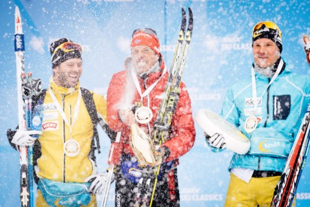 Team Santander's Anders Aukland (c) after winning the 2014 La Sgambeda in Livigno, Italy. Johan Kjølstad  (l) and Øystein Pettersen (r) both of Team United Bakeries, placed second and third, respectively.  (Photo: Ski Classics) 