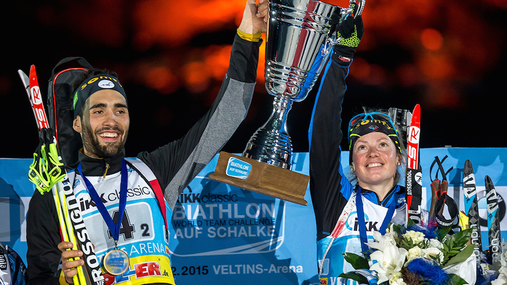 French teammates Martin Fourcade and Marie Dorin-Habert hoist the new cup challenge trophy after winning the 2015 Biathlon World Team Challenge on Dec. 28.  (Photo: Biathlon-aufSchalke.de)