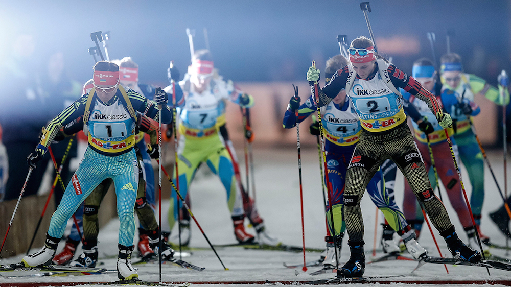 Ukraine’s Valj Semerenko (bib 1, left) and Germany’s Vanessa Hinz (bib 2, right) lead a group of athletes on the outside section of the ski track during the 2015 World Team Challenge in Gelsenkirchen, Germany.  (Photo: Biathlon-aufSchalke.de) 