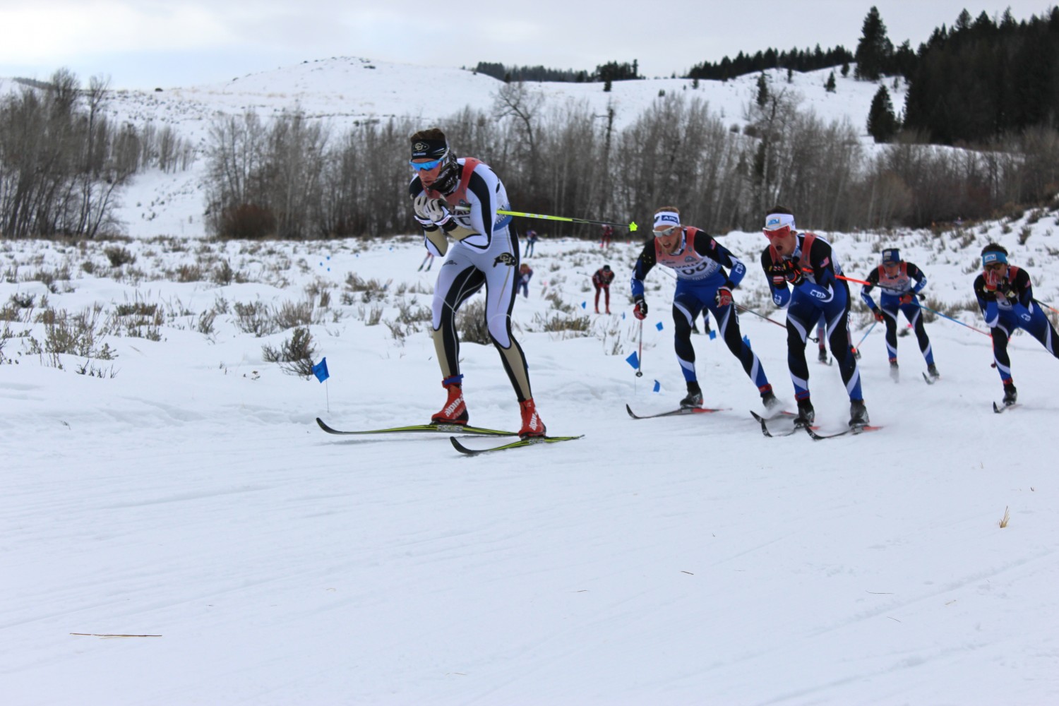 Left to right: Mads Strøm (University of Colorado Boulder) is trailed closely by Eric Packer (APU), David Norris (APU), Scott Patterson (APU) and Lex Treinen (APU) during the men's SuperTour 15 k classic mass start on Sunday in Sun Valley, Idaho.