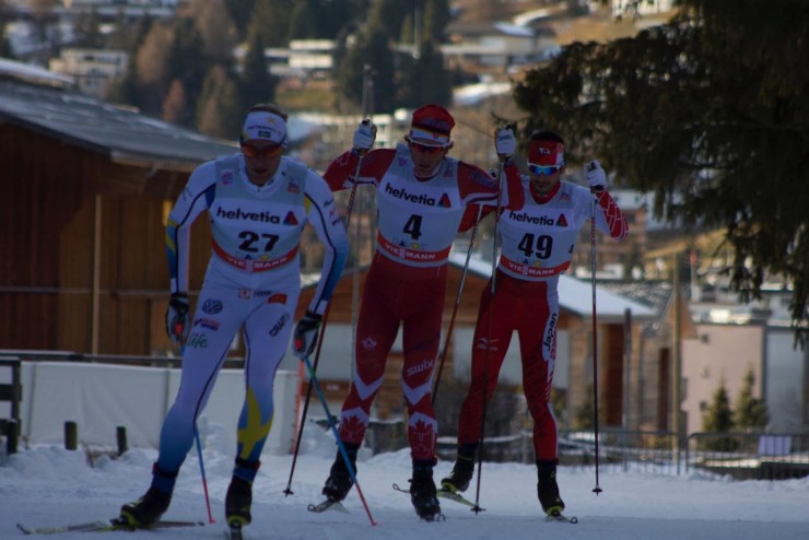 Canada's Devon Kershaw (c) skis with Sweden's Daniel Richardsson (27) and ahead of Japan's Akira Lenting during the World Cup 30 k freestyle individual start in Davos, Switzerland.