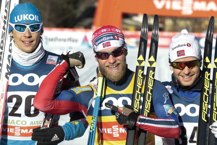 Norway's Martin Johnsrud Sundby shows off his arm strength after double poling the entire 15 k classic at the World Cup in Toblach, Italy. He won by 12.6 seconds over Russian runner-up Alexander Bessmertnykh (l) and Norwegian teammate Sjur Røthe (r) in third. (Photo: Fischer/NordicFocus)
